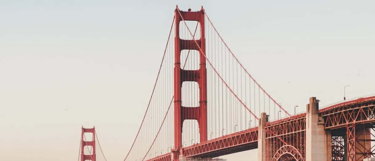 Main image of San page with a cityscape background